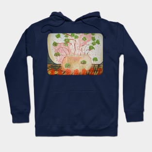 green flowers in a flower pot on a table. Hoodie